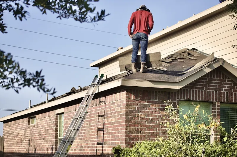 Professional roofer working on a residential roof in Keasbey